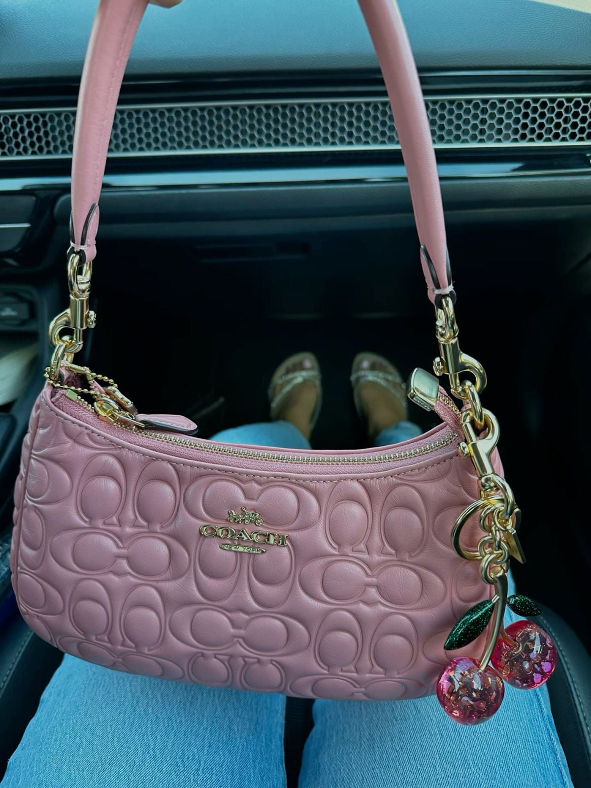Pink purse with cherry charm