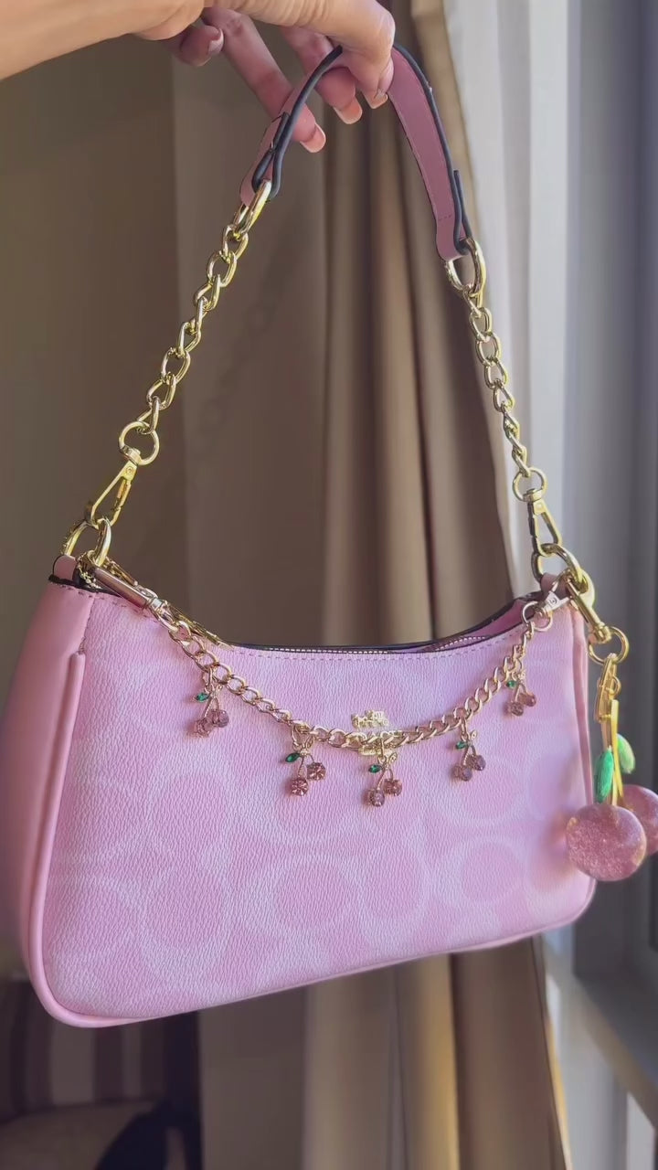 Pink purse with cherry charms