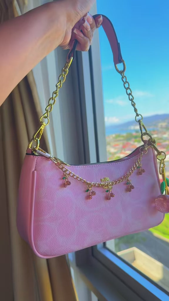 Pink purse with cherry charms